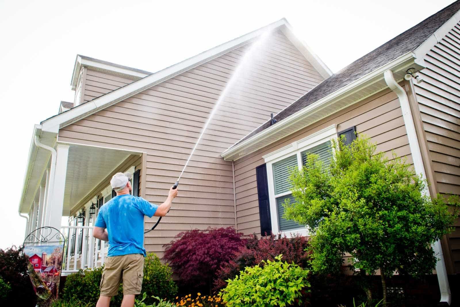 Mansfield Services pressure washing a home exterior in Vermont