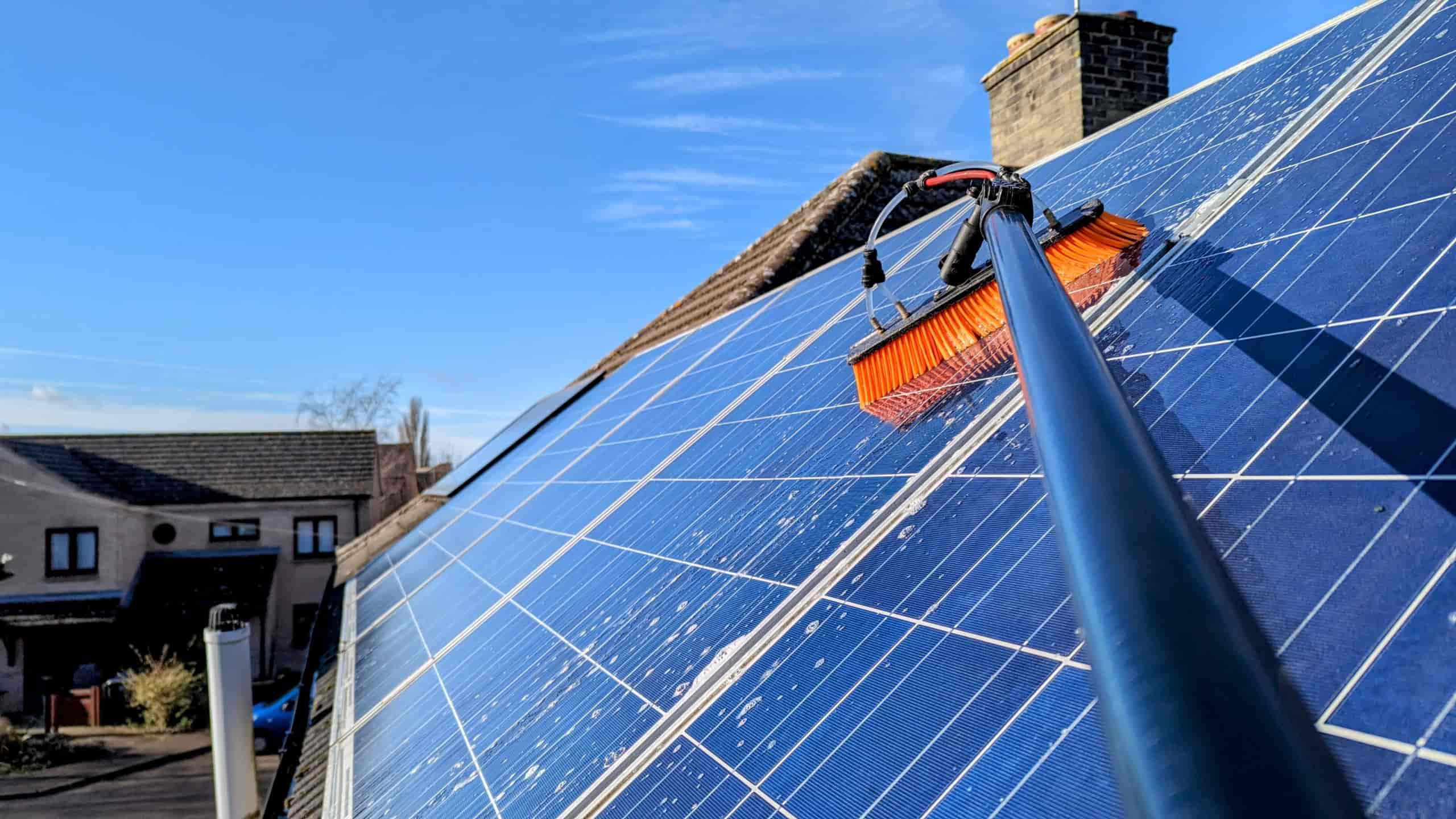 Mansfield Services cleaning solar panels at a Vermont home