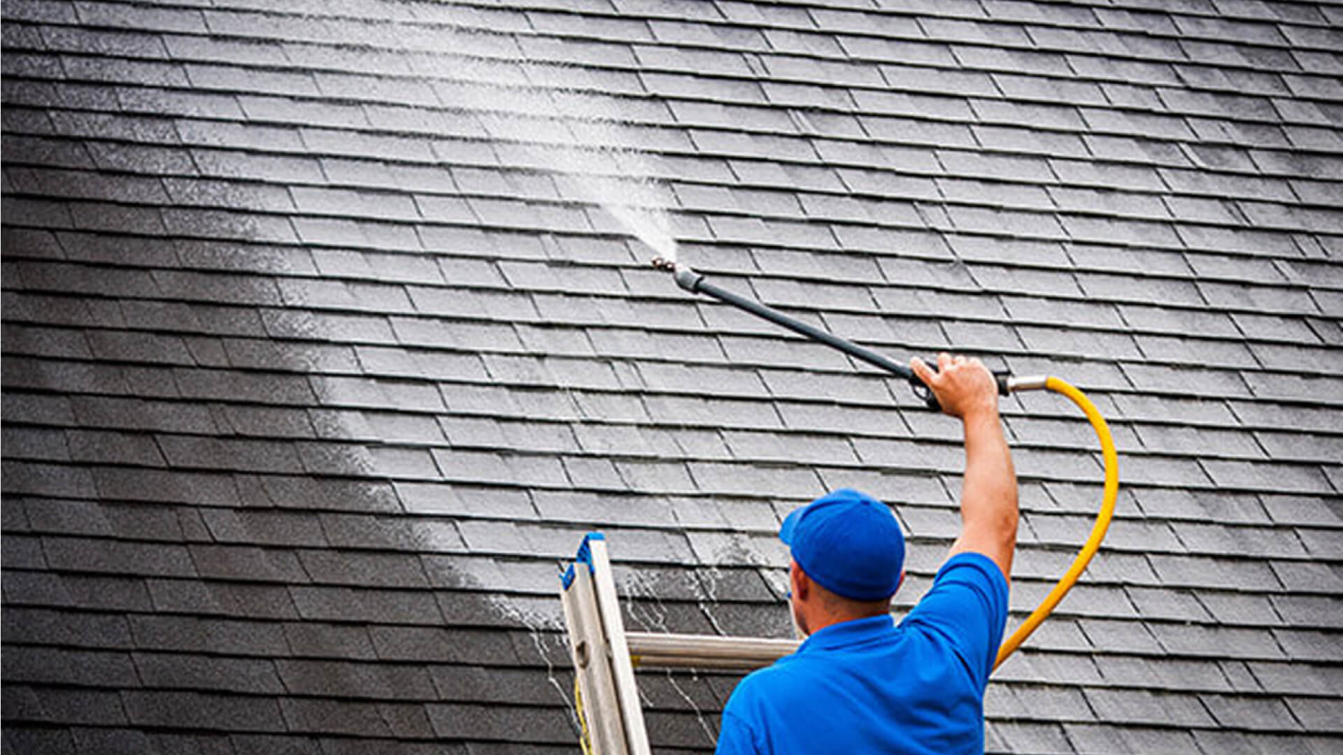 Black algae streaks on a Vermont roof, treated by Mansfield Services soft washing