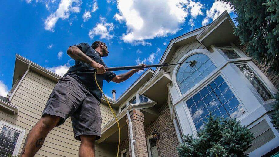 Exterior window cleaning with a water-fed pole and pure water on a Vermont home